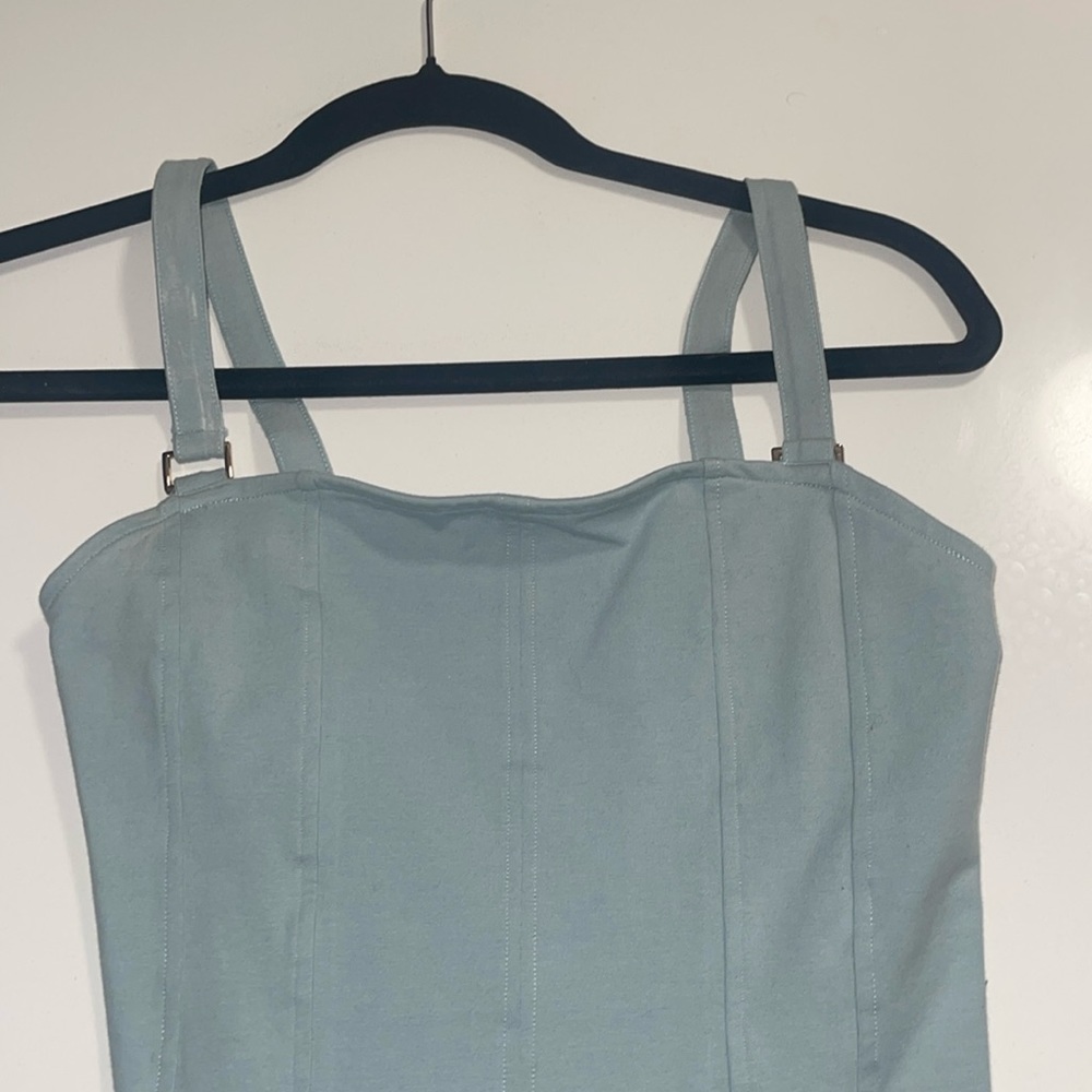 Very cute light blue h&m bodysuit with gold details on straps